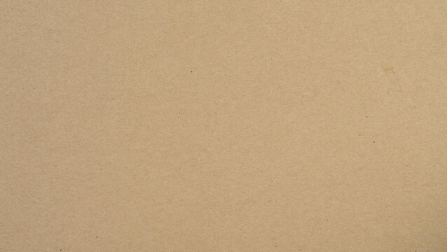 Abstract brown recycled paper background.
Old Kraft paper texture box craft stripes pattern.
top view.