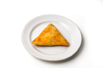 Mayo rissoles are triangular in shape, on a white plate