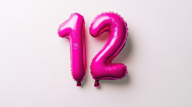 Pink number twelve balloons on white background, birthday celebration