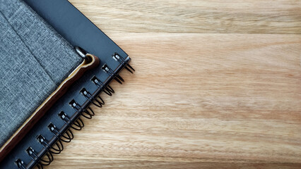 Notebooks on the wooden table with copy space