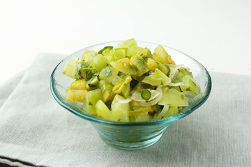 Delicious salsa (Pico de gallo) in bowl on white table, closeup