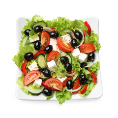 Delicious fresh Greek salad isolated on white, top view