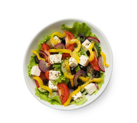 Delicious fresh Greek salad in bowl on white background, top view