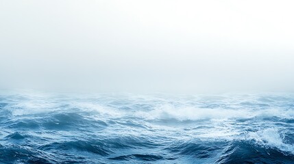 Fototapeta premium Misty Ocean Waves Rolling Under A Pale Sky