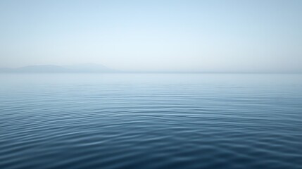 Obraz premium Serene Calm Water Meets Misty Distant Mountains