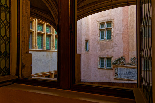 An old Renaissance courtyard in city center through the frame of a window