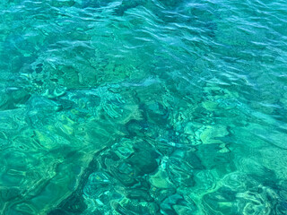 Sea water clear aquamarine blue surface.