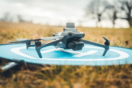 Drone with camera, an unmanned flying aircraft, The drone photographs the horizons - Powered by Adobe