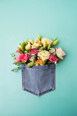 Flowers in a jeans back pocket concept