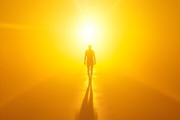 Walking Towards the Light: A solitary figure walks confidently towards a brilliant, radiant light, enveloped in a warm golden mist. The silhouette evokes a sense of hope, faith.