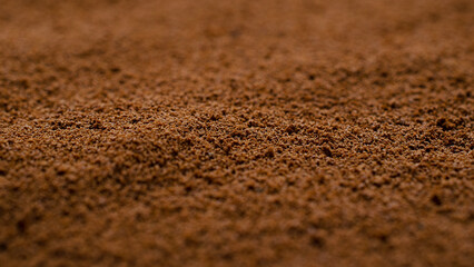 Background of instant coffee closeup, banner. Coffee powder texture, top view. Ground, instant coffee background, texture, top view. Texture of brown coffee powder, banner.