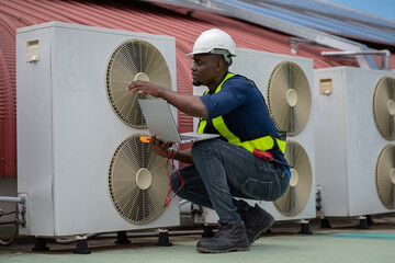 Engineers are inspecting the air conditioning system in a large building or industrial facility.