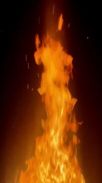 A flaming fire with orange hot flames on a black background