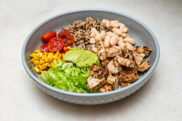 Fiesta bowl, Mexican food dish bowl with chicken, rice, corn and vegetables. Taco or burrito bowl. 