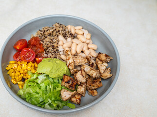 Fiesta bowl, Mexican food dish bowl with chicken, rice, corn and vegetables. Taco or burrito bowl. 