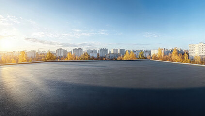 A commercial building with a flat roof featuring a single-ply EPDM membrane, set against a clear blue sky 
