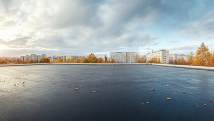 Fototapeta premium A commercial building with a flat roof featuring a single-ply EPDM membrane, set against a clear blue sky 