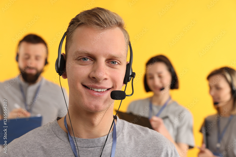 Poster technical support call center. smiling operator on yellow background, selective focus