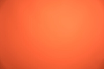 Smooth and vibrant orange gradient background creates a seamless transition, perfect for various design projects requiring a warm and inviting backdrop