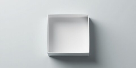 Empty White Square Cardboard Box on a Light Gray Background, Ready for Product Placement or Packaging Design Mockup