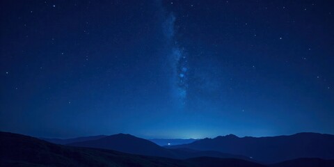 Fototapeta premium Celestial Canvas A Night Sky Panorama Featuring the Milky Way Arching Over a Silhouetted Mountain Range