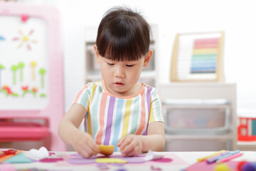 A young girl was creating a craft at home