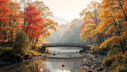Obraz premium Tranquil autumn scene with wooden bridge colorful maple trees and misty morning light