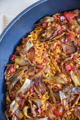 rice paella with artichokes and vegetables