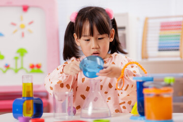 A young girl was conducting a science experiment at home.	
