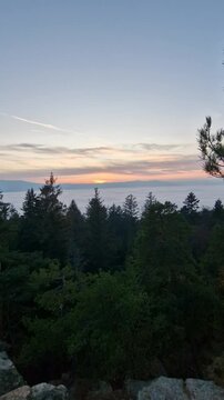 beautiful sunset visible from the mountain kluk mountain peaking from cloud inversion