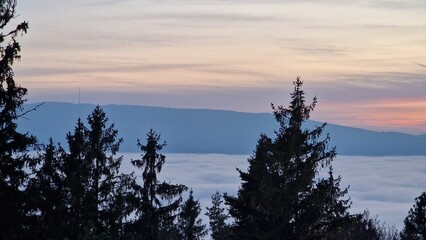beautiful sunset visible from the mountain kluk mountain peaking from cloud inversion