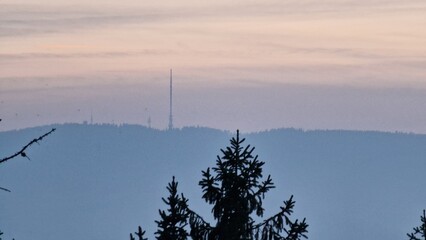 beautiful sunset visible from the mountain kluk mountain peaking from cloud inversion