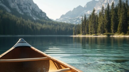 Fototapeta premium A serene scene of a canoe floating on a calm lake, surrounded by majestic mountains