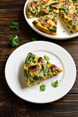 Frittata with spinach and champignon mushrooms