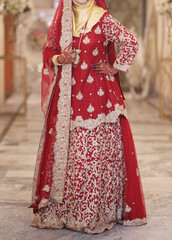 Golden Accents and Scarlet Charm: A Bridal Vision in Red