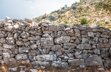 Ancient wall texture background with old bricks and stones
