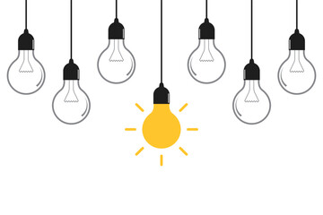 Hanging light bulbs on yellow background