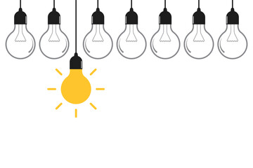 Creative idea. Hanging light bulbs on yellow background