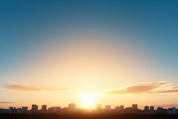 Fototapeta premium Stunning sunset view over a city skyline with silhouettes of buildings