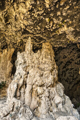 Cave interior with visible effects of karst processes like stalagmite and stalactite