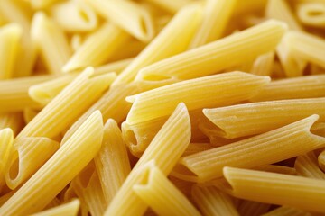 Close-up of uncooked penne pasta.