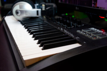 Musical production working close up keyboard