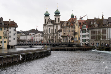 Naklejka premium Cityscape view of Lucerne Switzerland as seen from the Reuss River