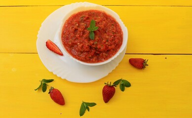 Gazpacho is a classic Spanish tomato soup flavored with mint, garlic, spices, and herbs. A must-try!