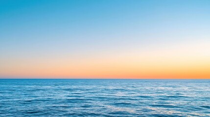 Obraz premium Tranquil Sunset Over Calm Blue Ocean With Orange And Pink Horizon