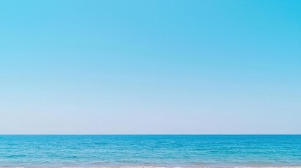 Fototapeta premium Tranquil Blue Ocean Meets Clear Sky at the Horizon