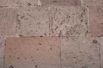Wall of a large stone. Warm tones