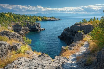 Scenic coastal view featuring rocky cliffs and tranquil water on a sunny day