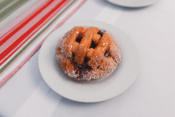 Close-up view of a small pastafrola served on a plate.