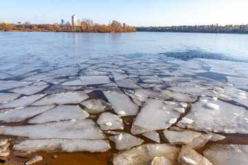 Ice floes in the Moskva river bank in warm sunny day of late winter. Ice drift is beginning....